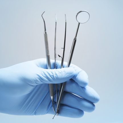 Close-up,Of,Dentist's,Hands,And,Dental,Equipment