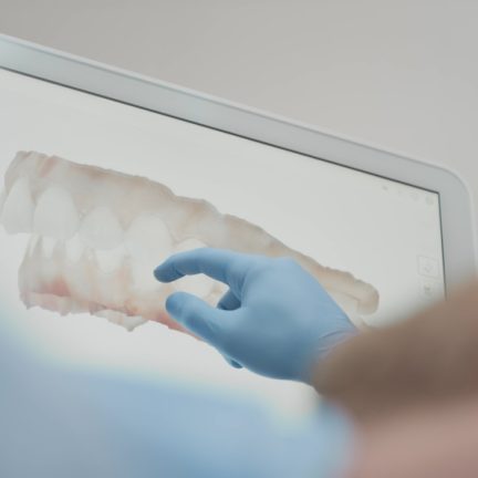 A,Male,Orthodontist,Doctor,Shows,On,The,Display,A,3d